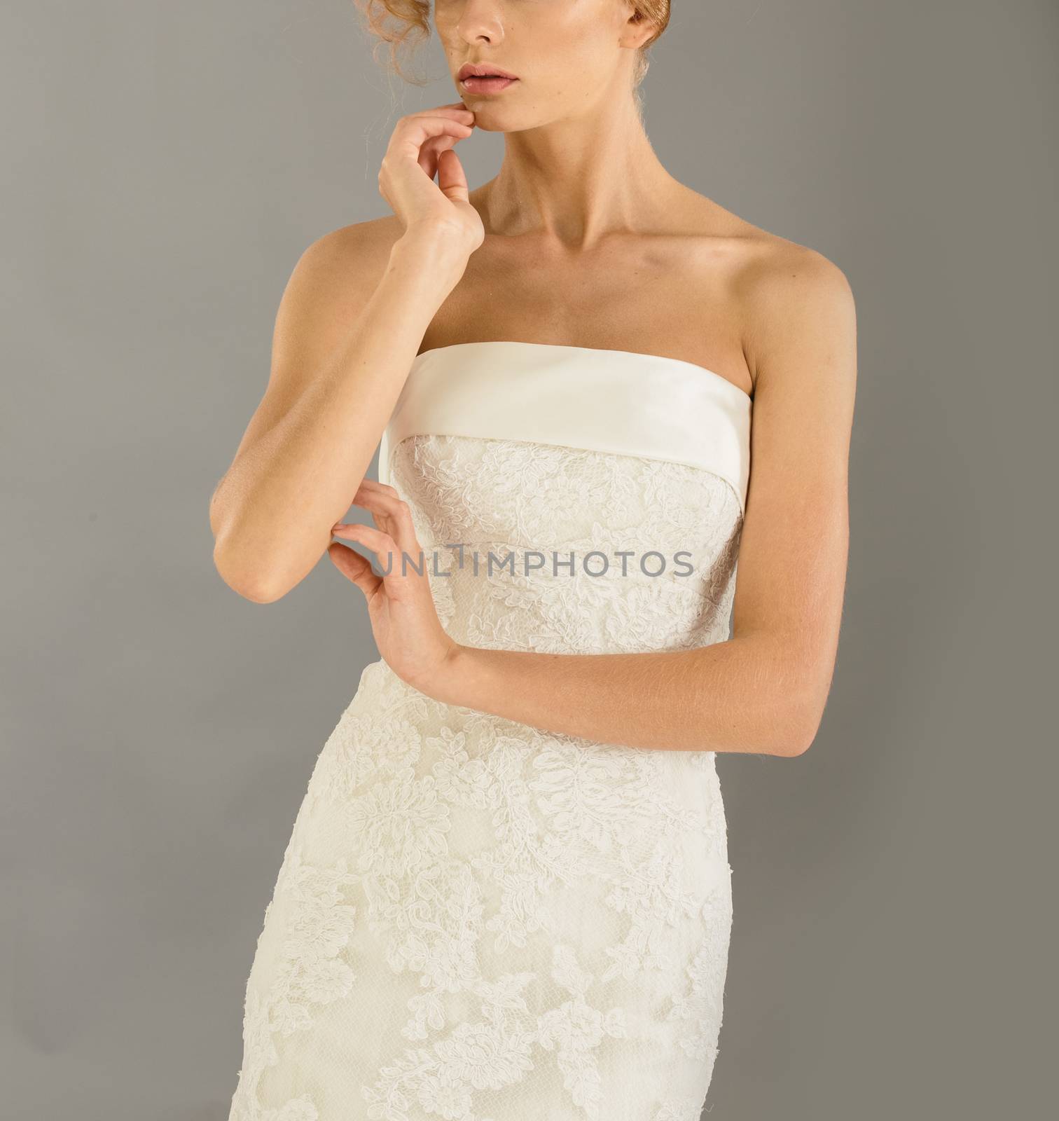 Beautiful bride on grey background. Studio shot