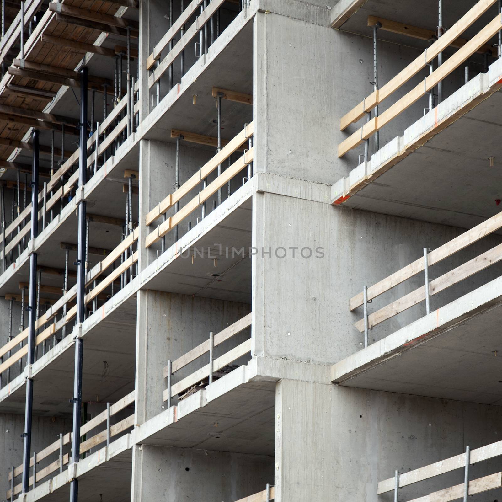 closeup of construction site with concrete walls by ahavelaar