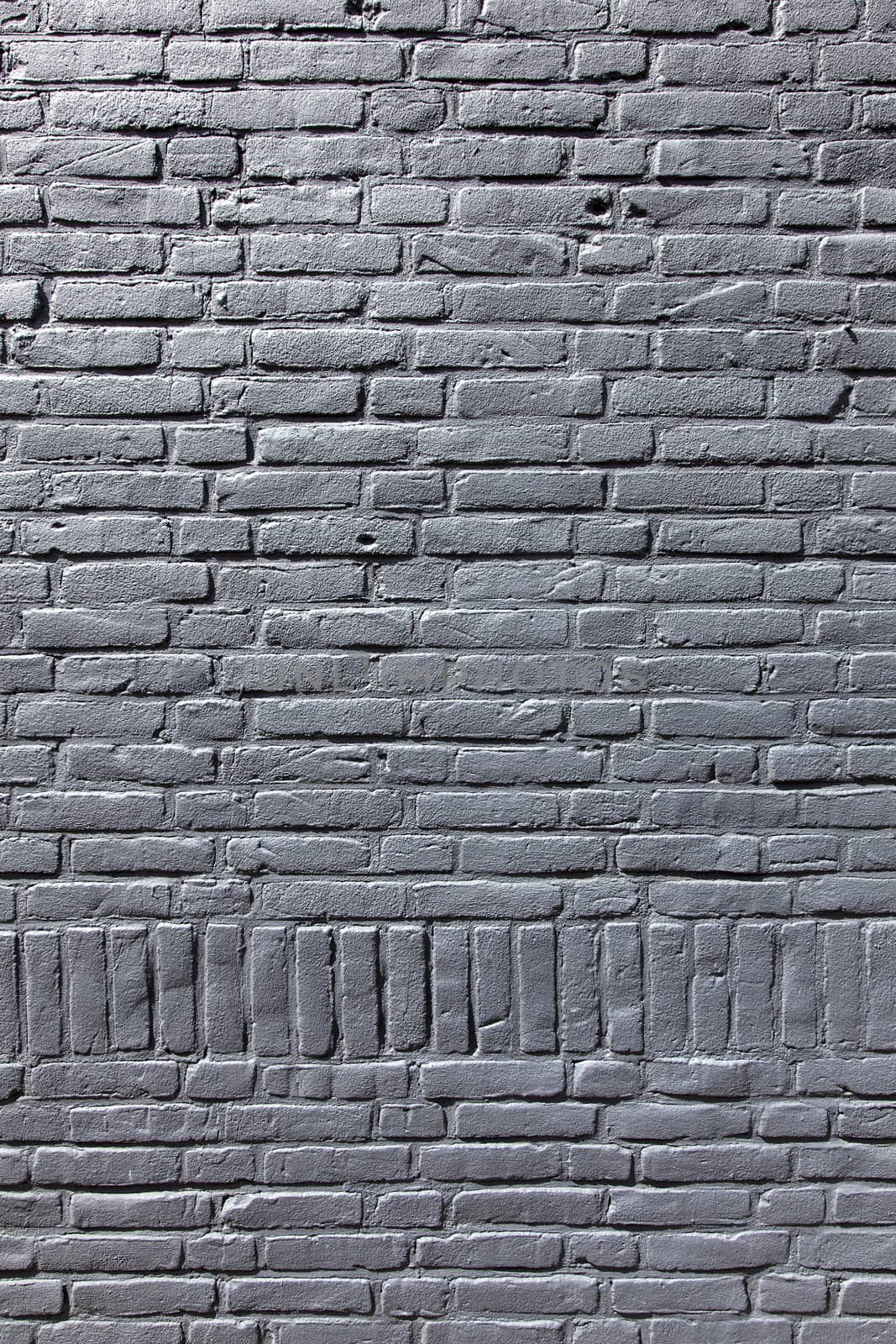 vertical part of grey painted brick wall