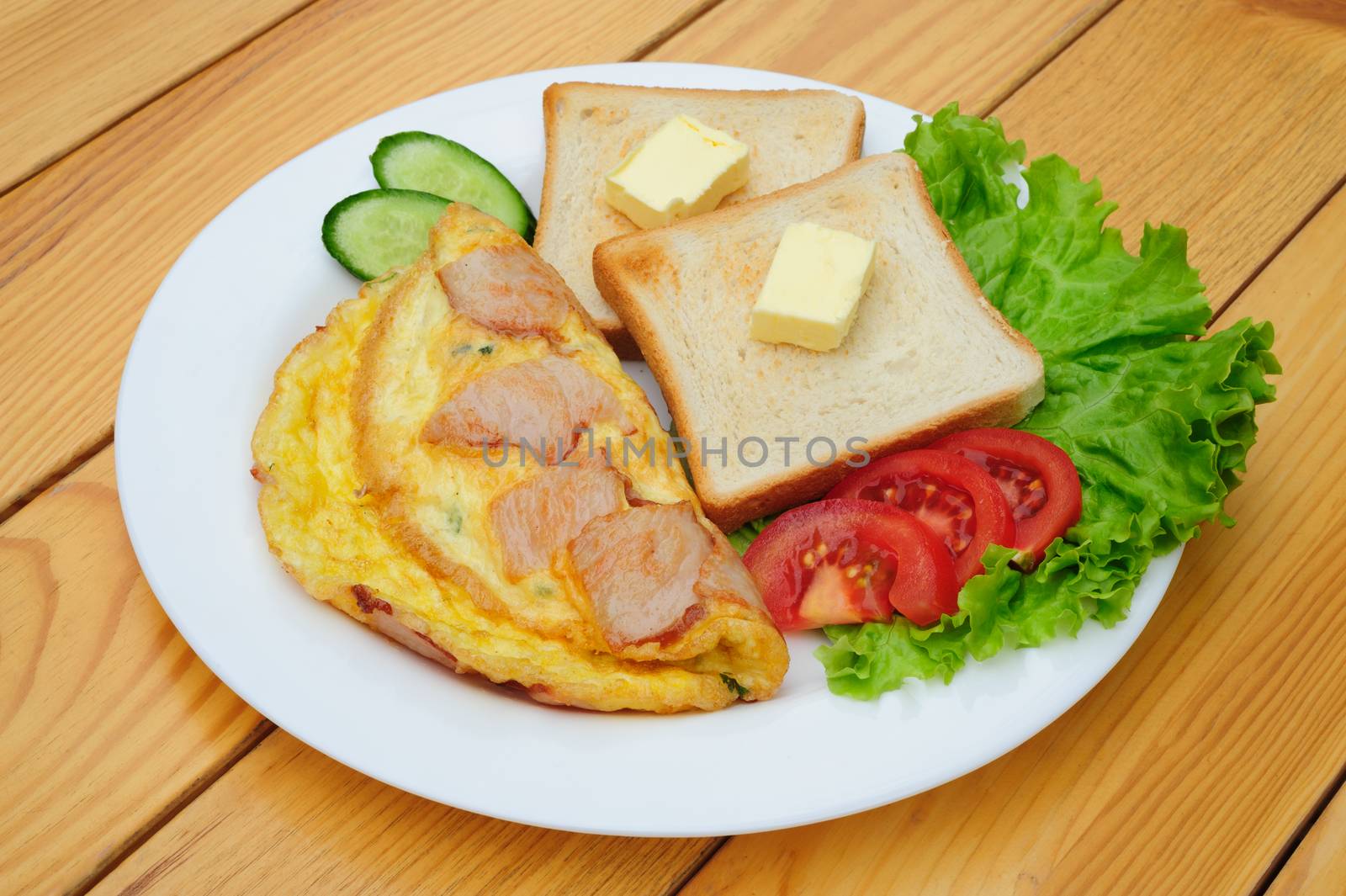 fresh country omelette with bacon, salad and toasts