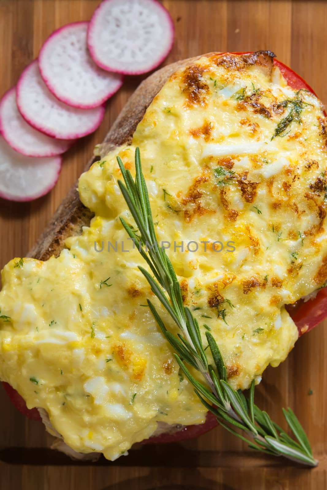 French toast ham cheese and salad on wooden table 