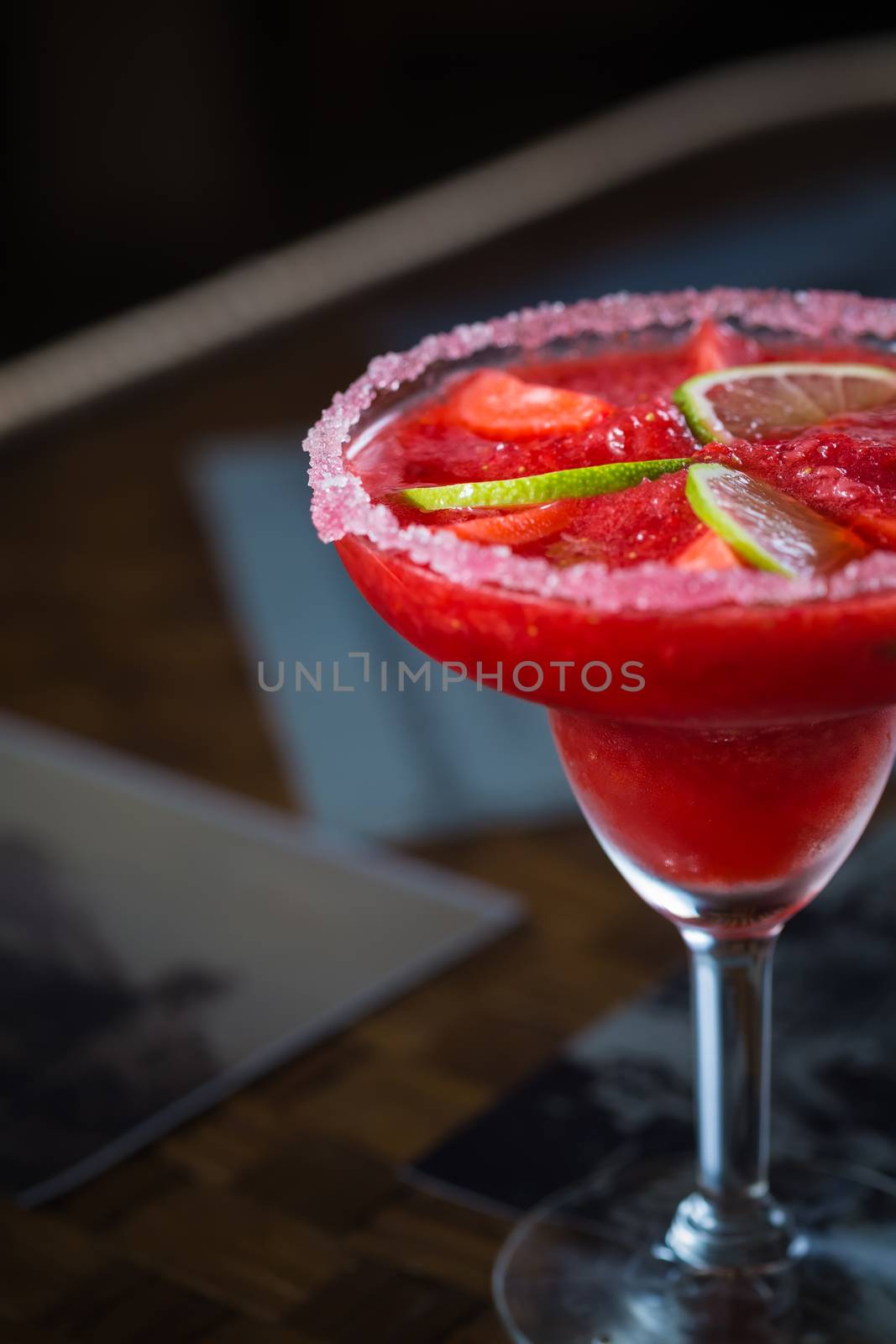 Strawberry margarita cocktail on the bar. Shallow dof