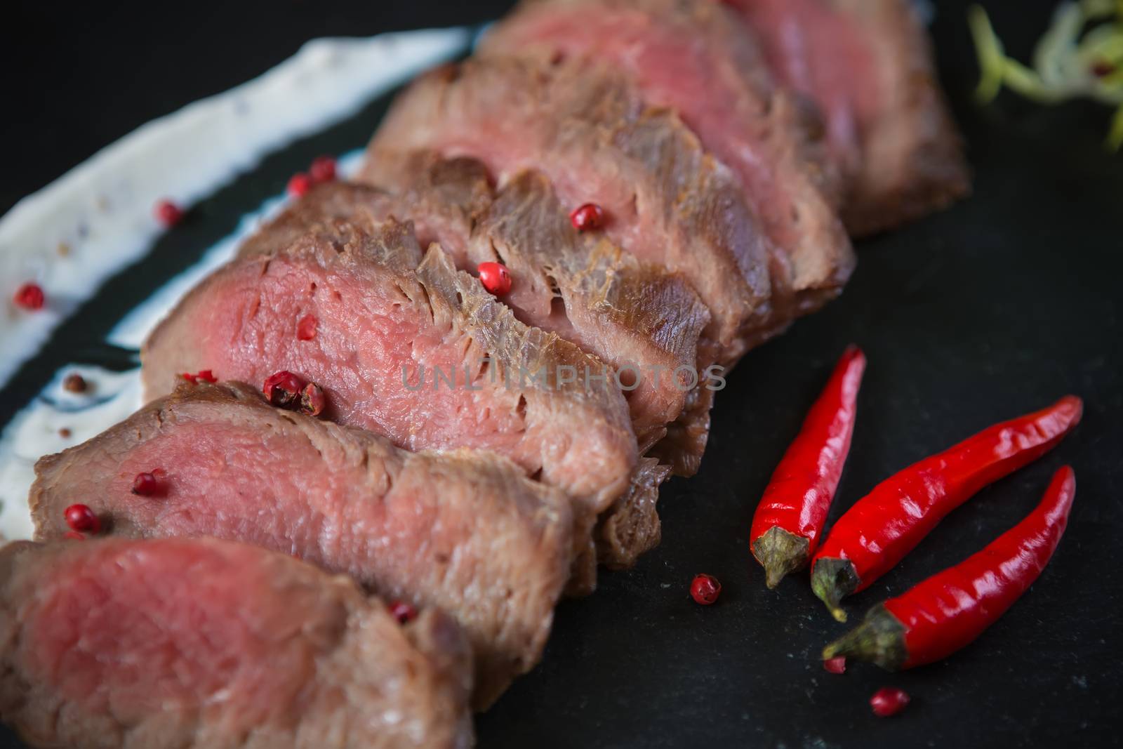 Medium Rare Cooked Beef Roast with Vegetables and Spices