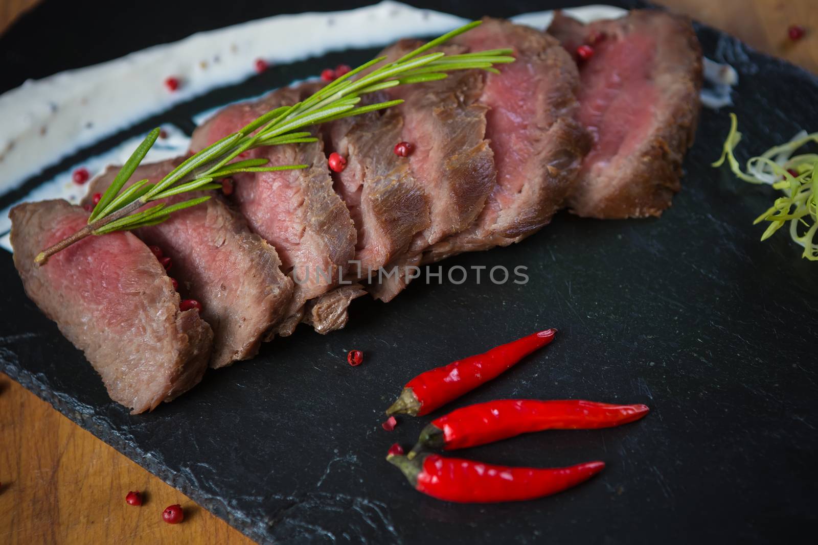 Medium Rare Cooked Beef Roast with Vegetables and Spices
