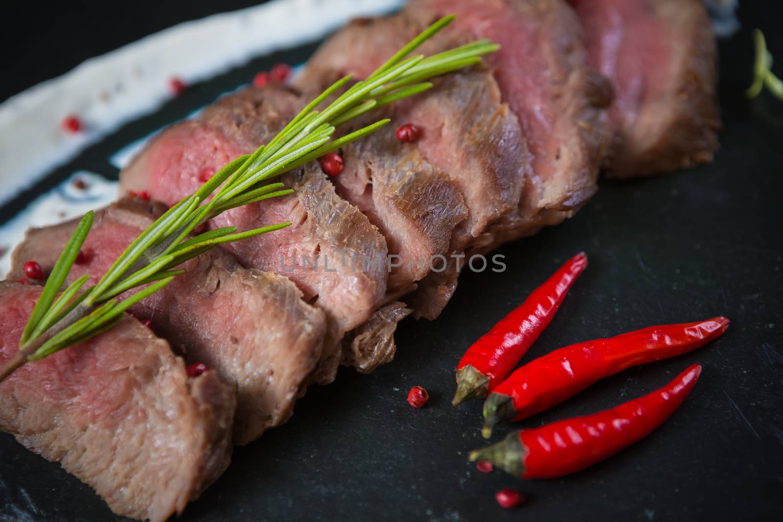 Medium Rare Cooked Beef Roast with Vegetables and Spices