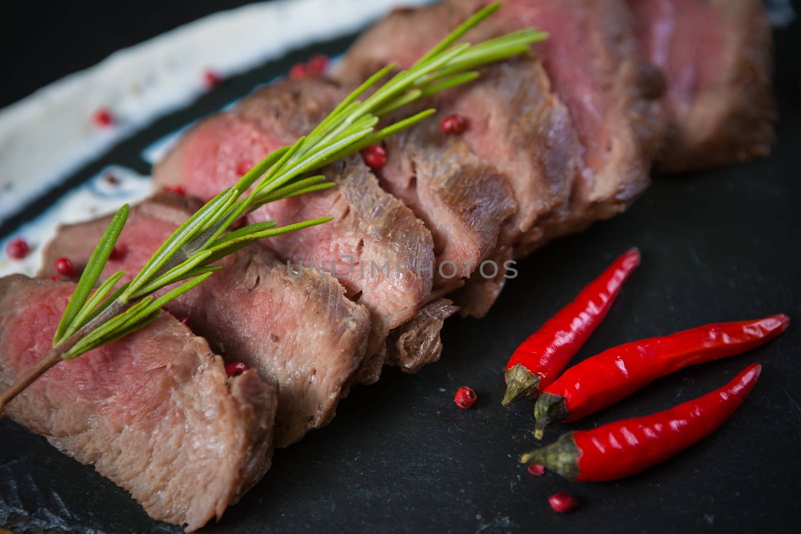 Medium Rare Cooked Beef Roast with Vegetables and Spices