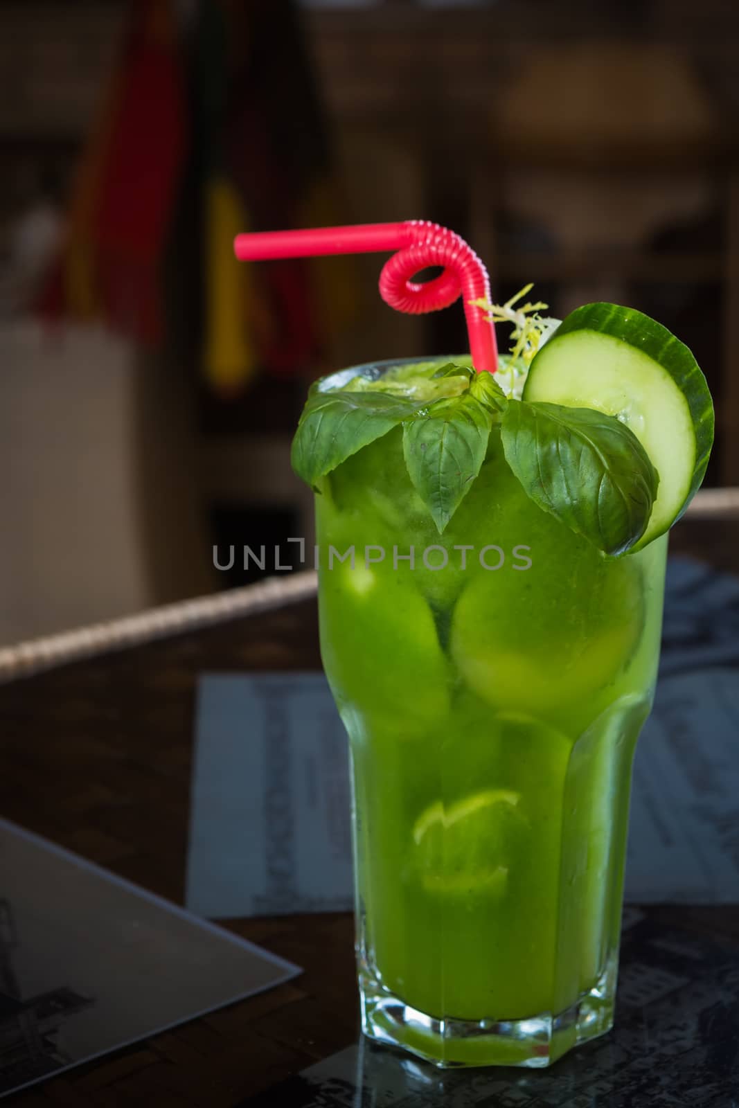 tropical green cocktail with lemon and fresh mint. Shallow dof