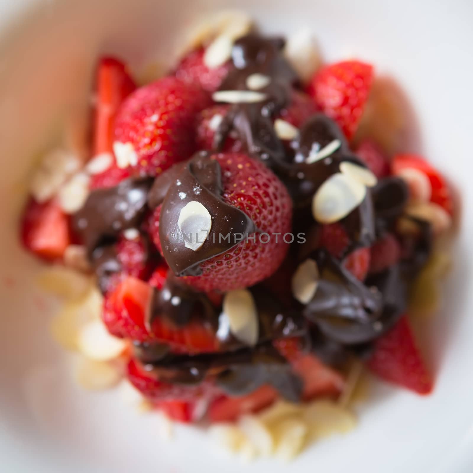 fresh strawberries dipped in dark chocolate. Shallow dof