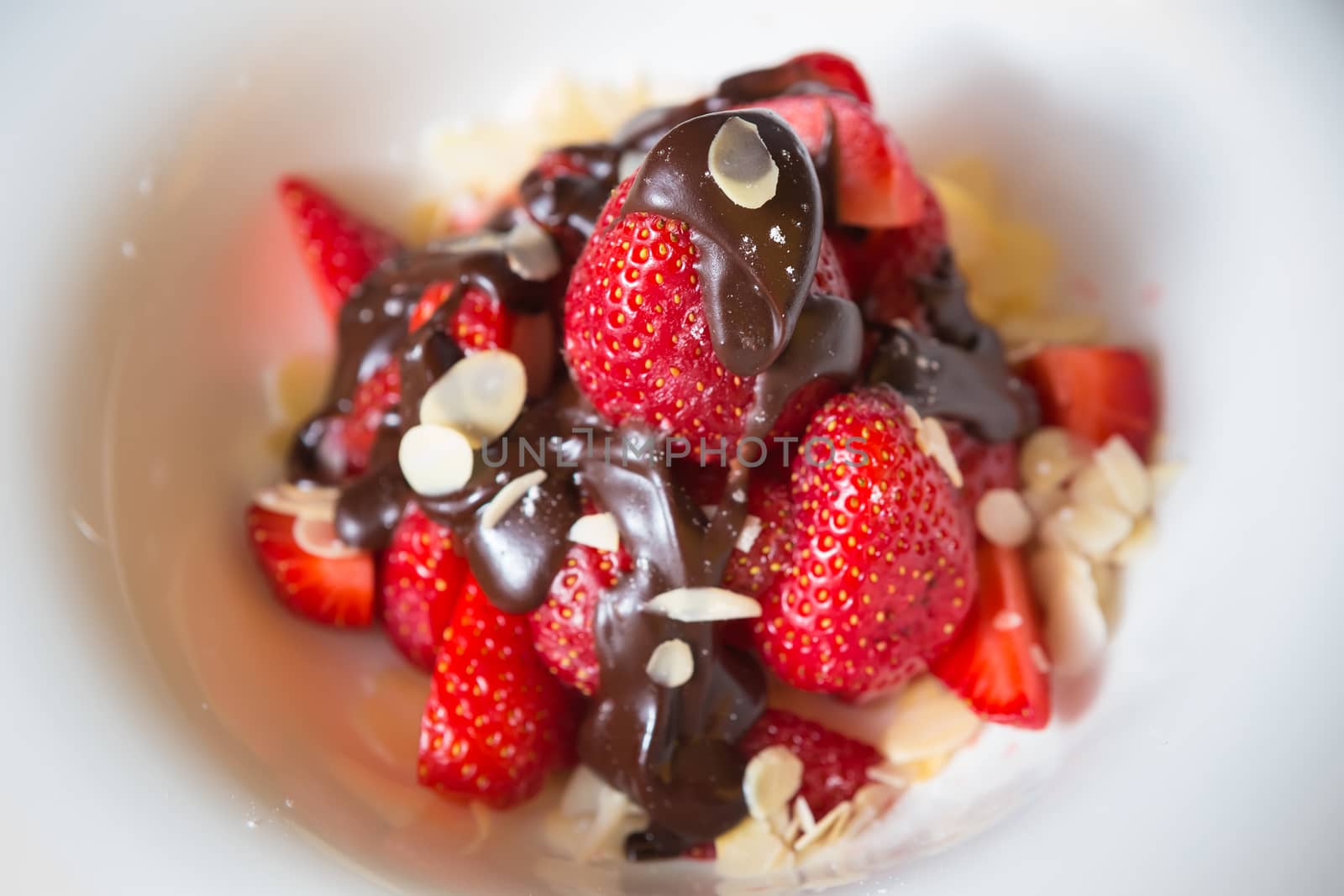 fresh strawberries dipped in dark chocolate. Shallow dof