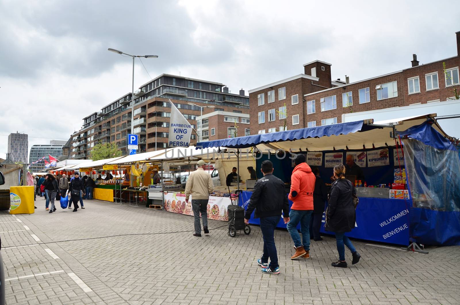 Rotterdam, Netherlands - May 9, 2015: Unidentified shoppers at the Street Market in Rotterdam. A large market is held in Binnenrotte, the biggest market square in the Netherlands.