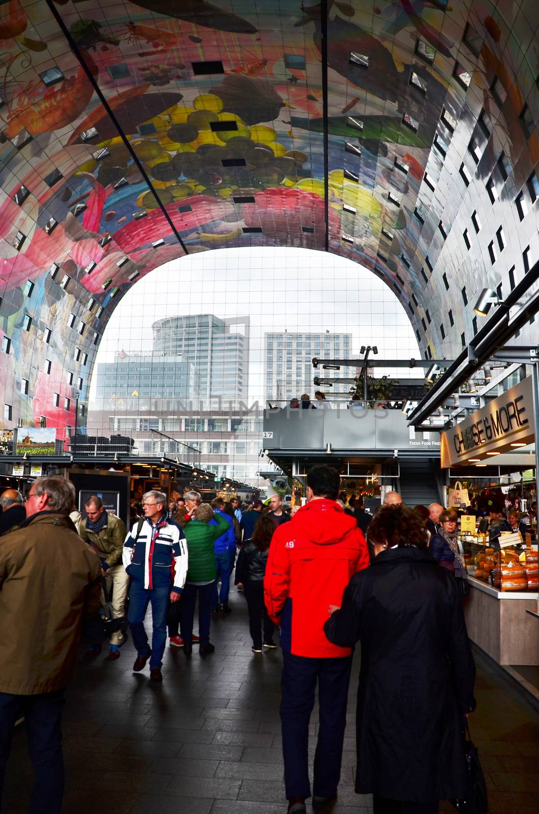 Rotterdam, Netherlands - May 9, 2015: People visit Markthal (Market hall) a new icon in Rotterdam. The covered food market and housing development shaped like a giant arch by Dutch architects MVRDV.