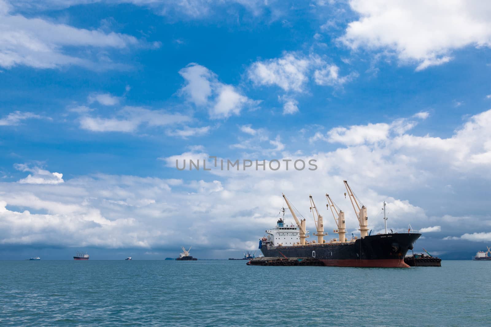 Cargo ship. Parking in the sea to await transportation to the port.