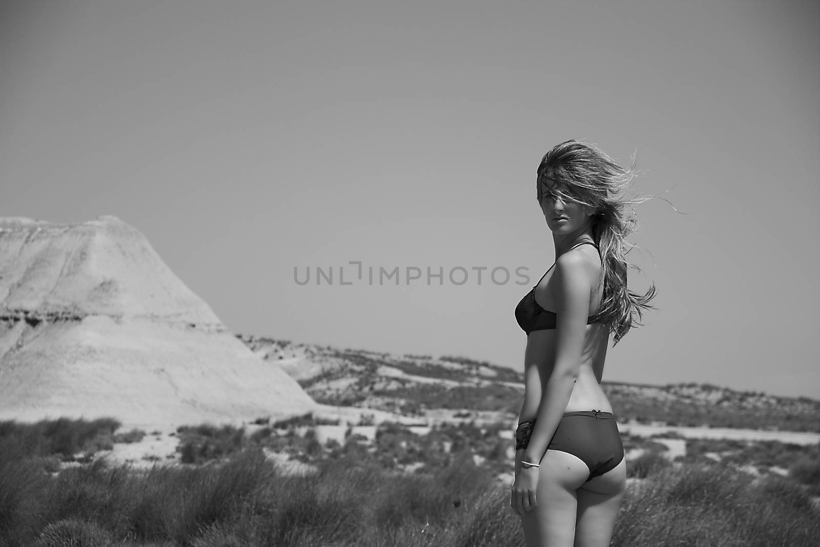 woman posing in lingerie in the desert