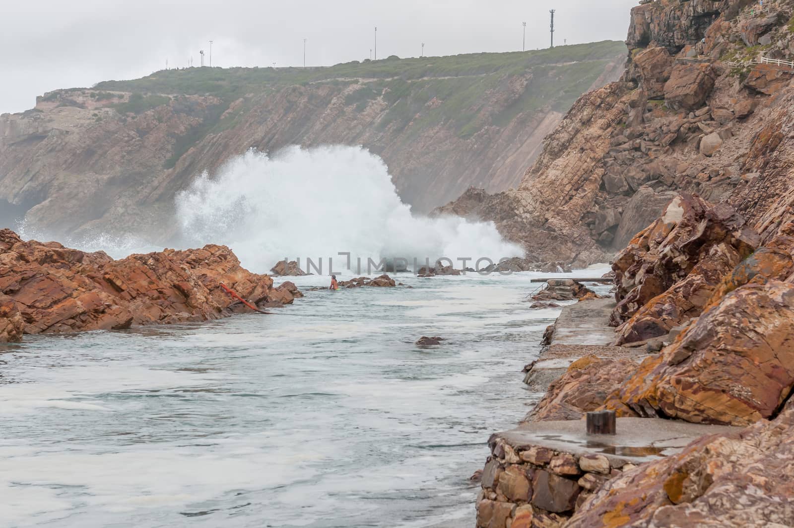 MOSSELBAY, SOUTH AFRICA - DECEMBER 27, 2014: The Point tidal swimming pool in Mosselbay, South Africa on a stormy day