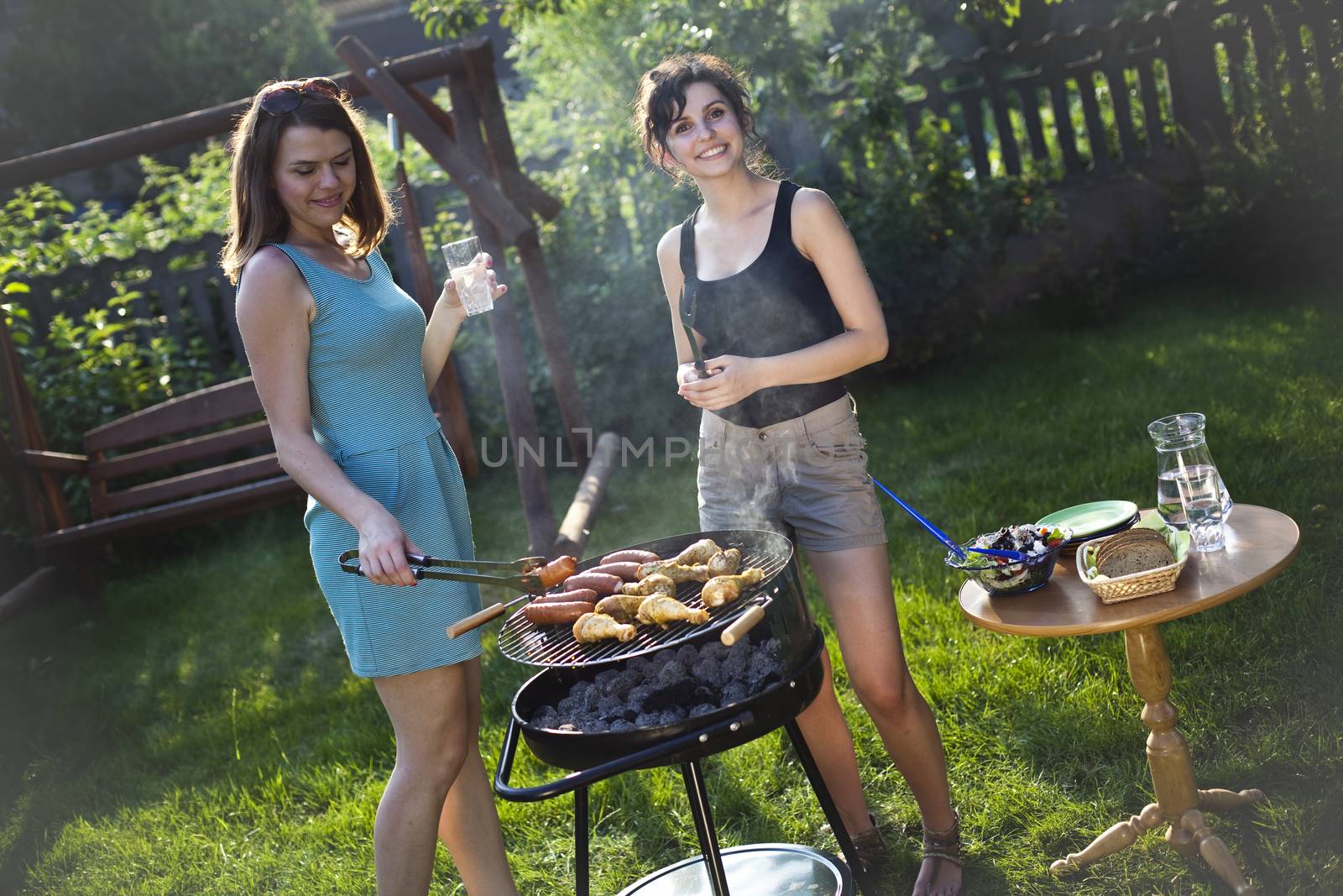 Two girls on grill, natural colorful tone