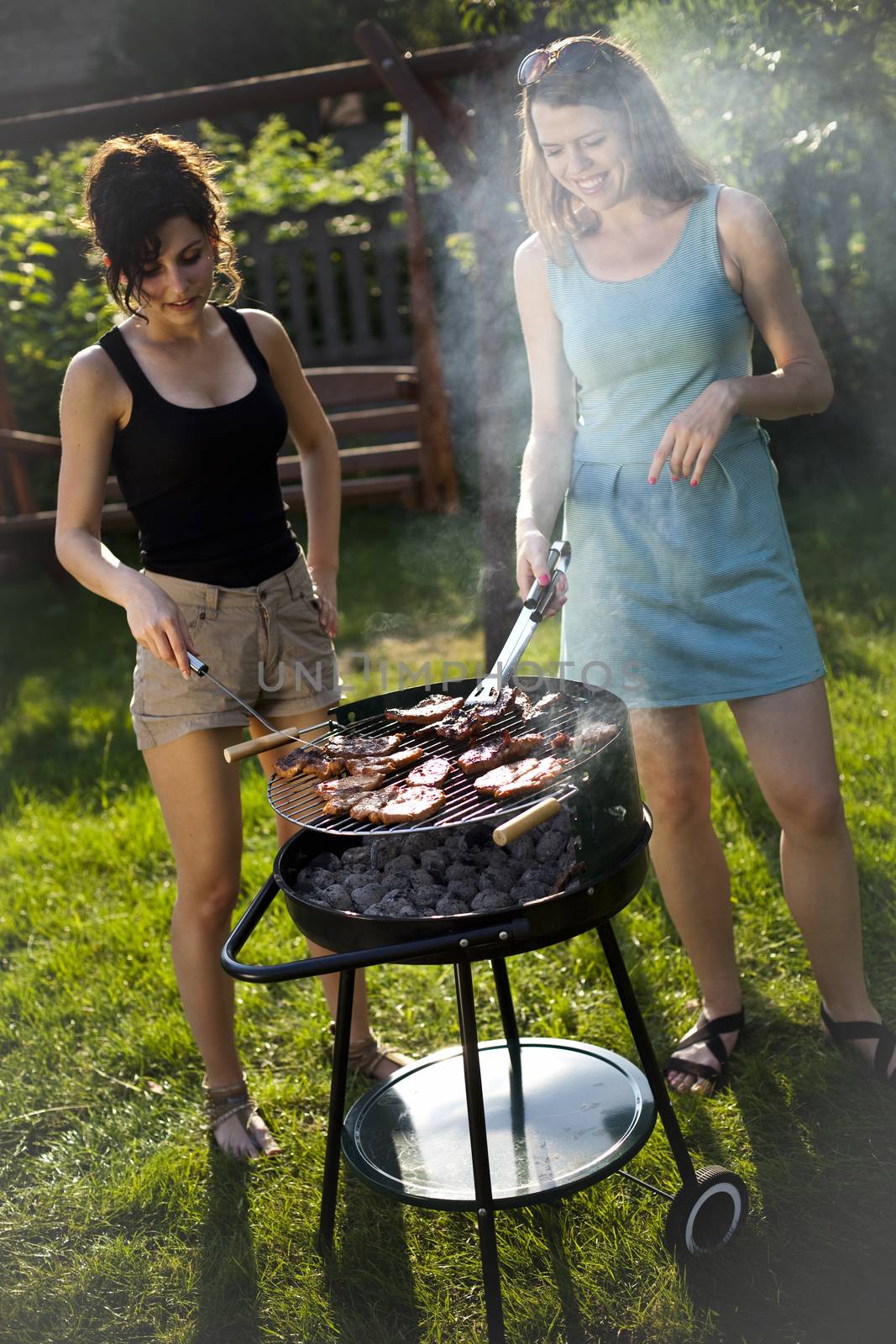 Two girls on grill, natural colorful tone by JanPietruszka