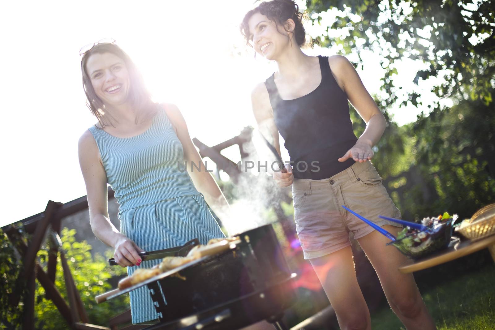 Two girls on grill, natural colorful tone