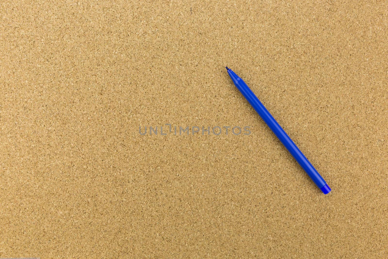 blue marker place on cork board