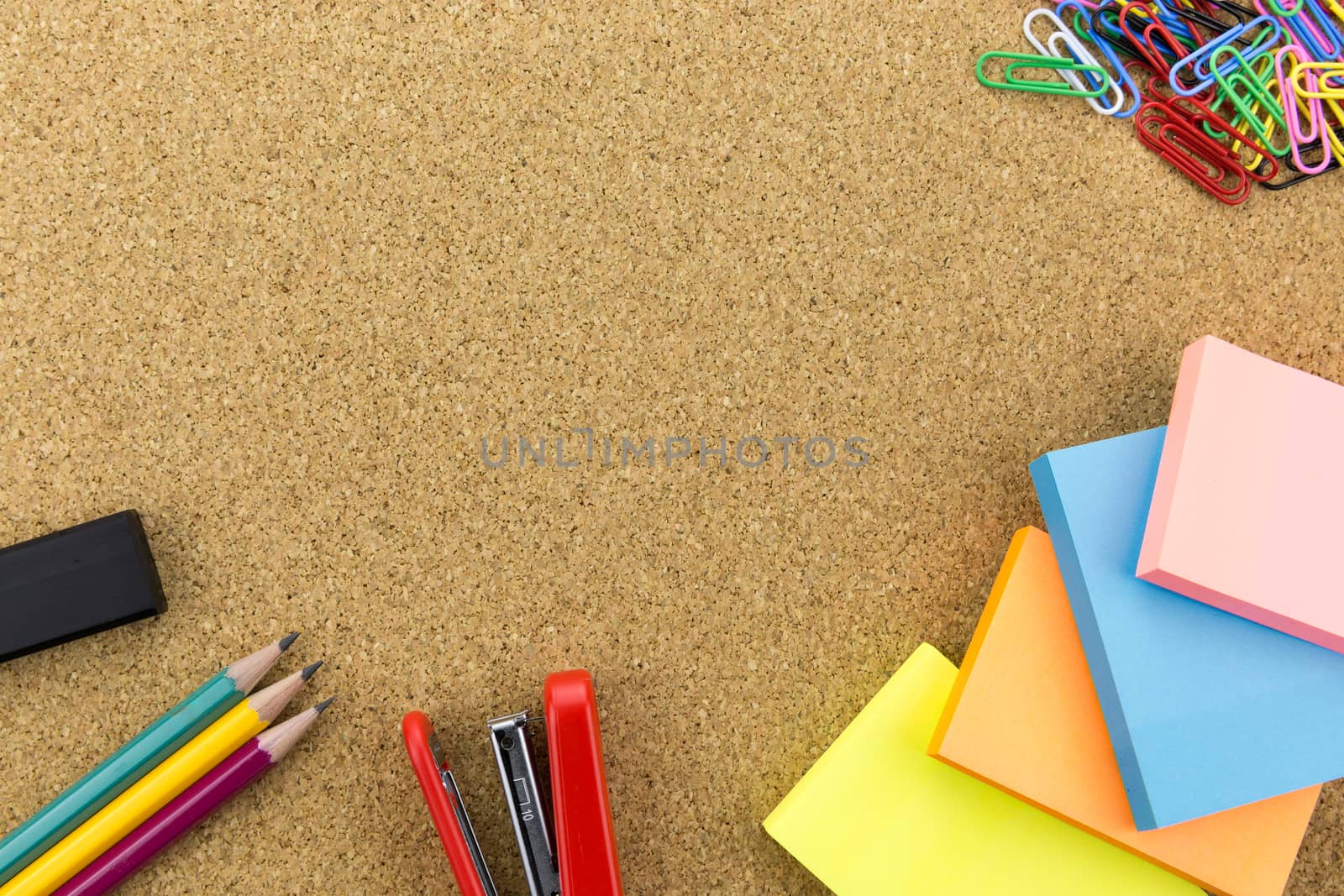 wallpaper stationary on cork board with many office supplies tools