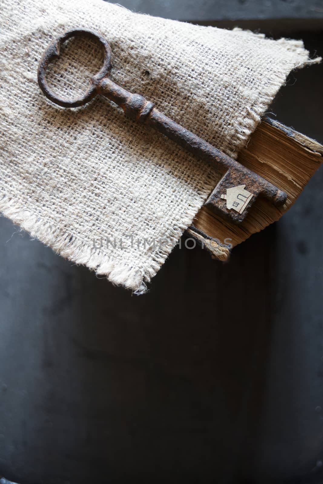 the key to the farm. Vintage key,  burlap and paper house.