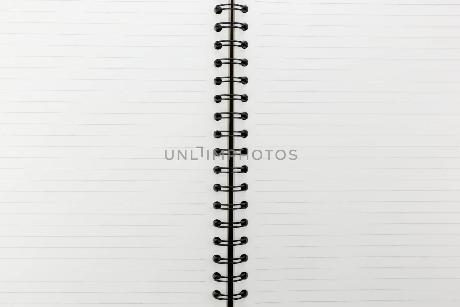 white notebook with line on cork board