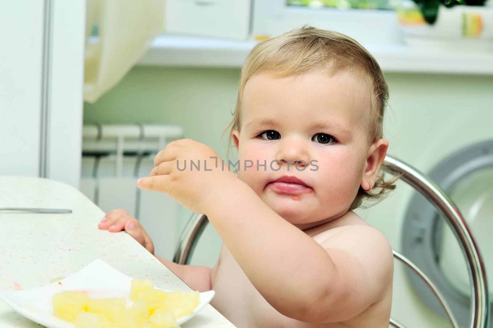 dirty mouth of little baby girl on the kitchen