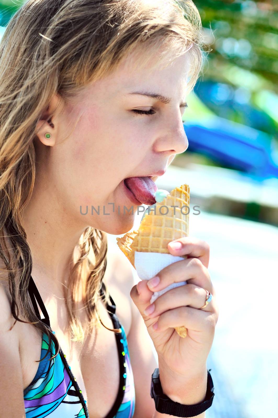 teen girl enjoying ice cream by Reana