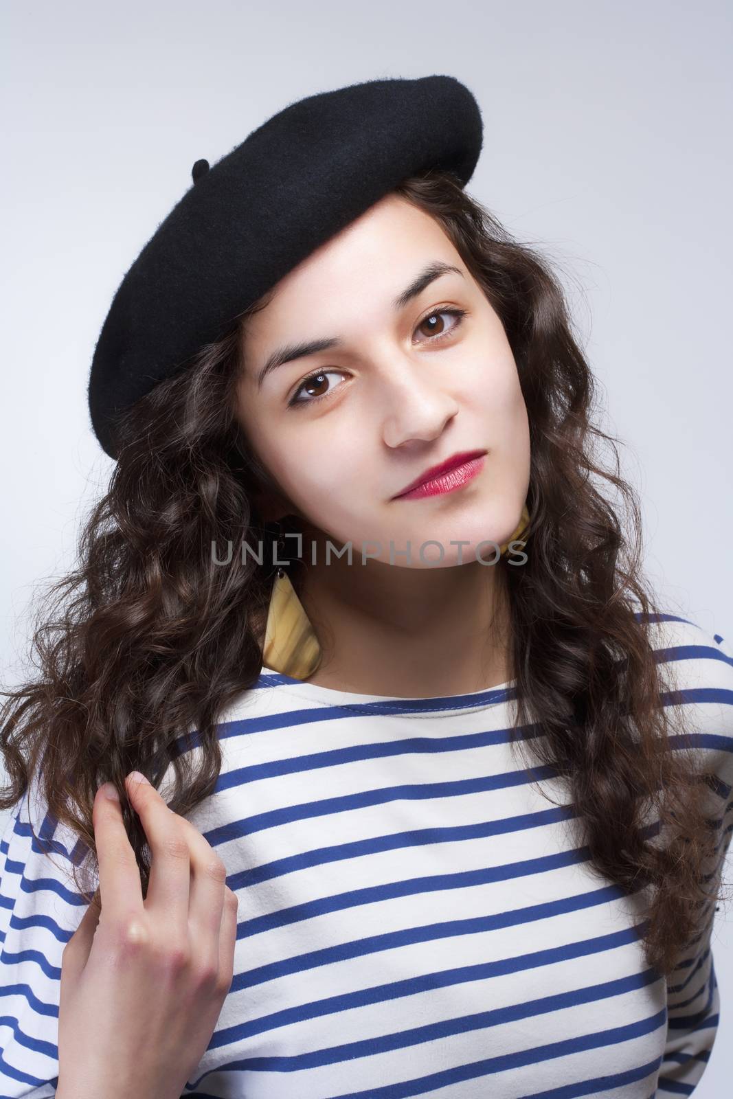 Woman with French Style Beret Hat and Striped T-shirt by courtyardpix