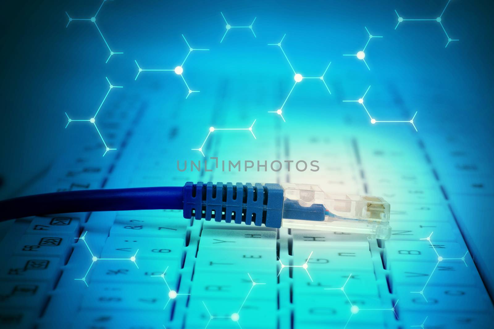 Computer cable on keyboard in abstract blue background with signs
