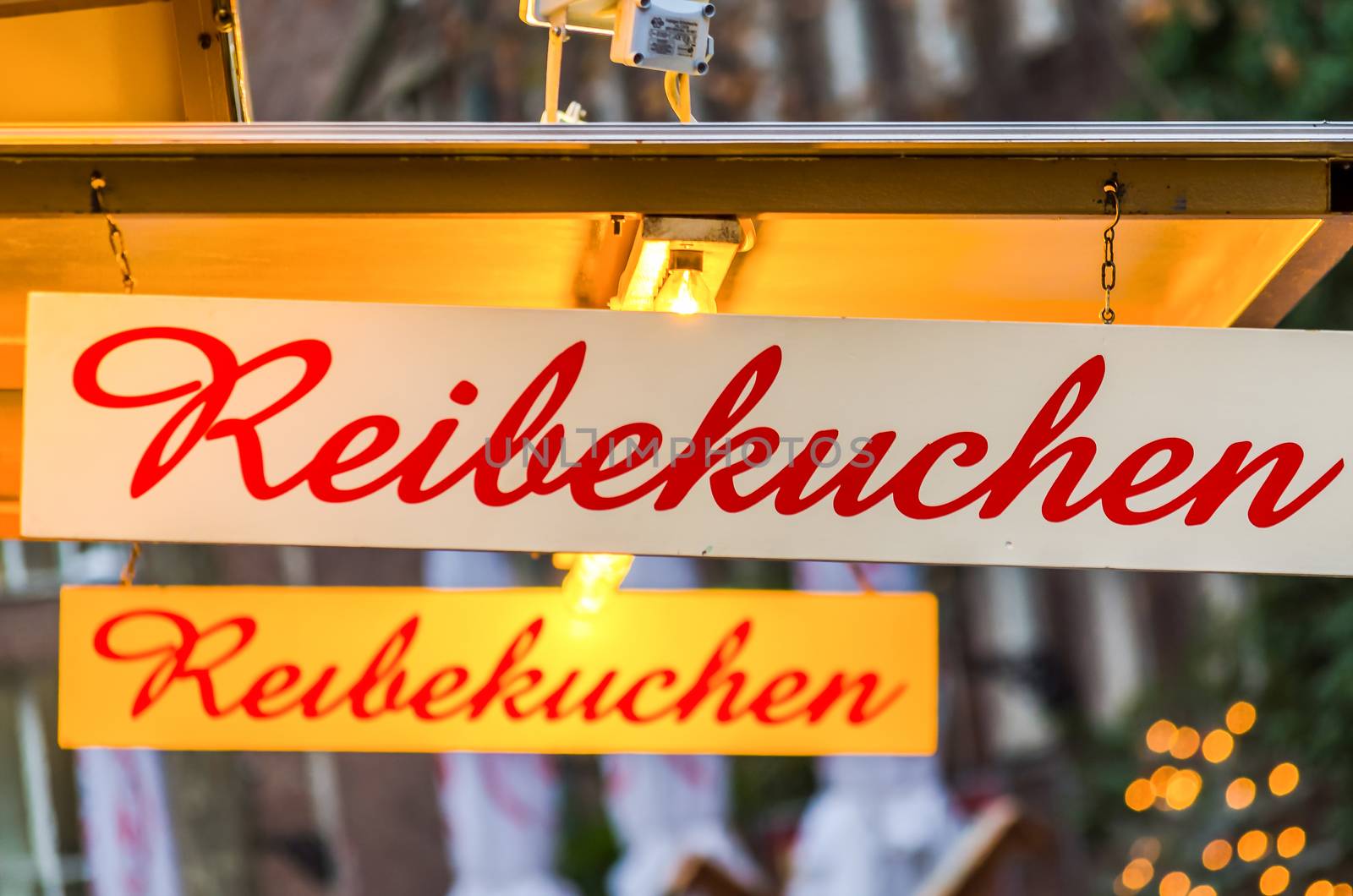 Shield on a Christmas market with the inscription potato pancakes.
