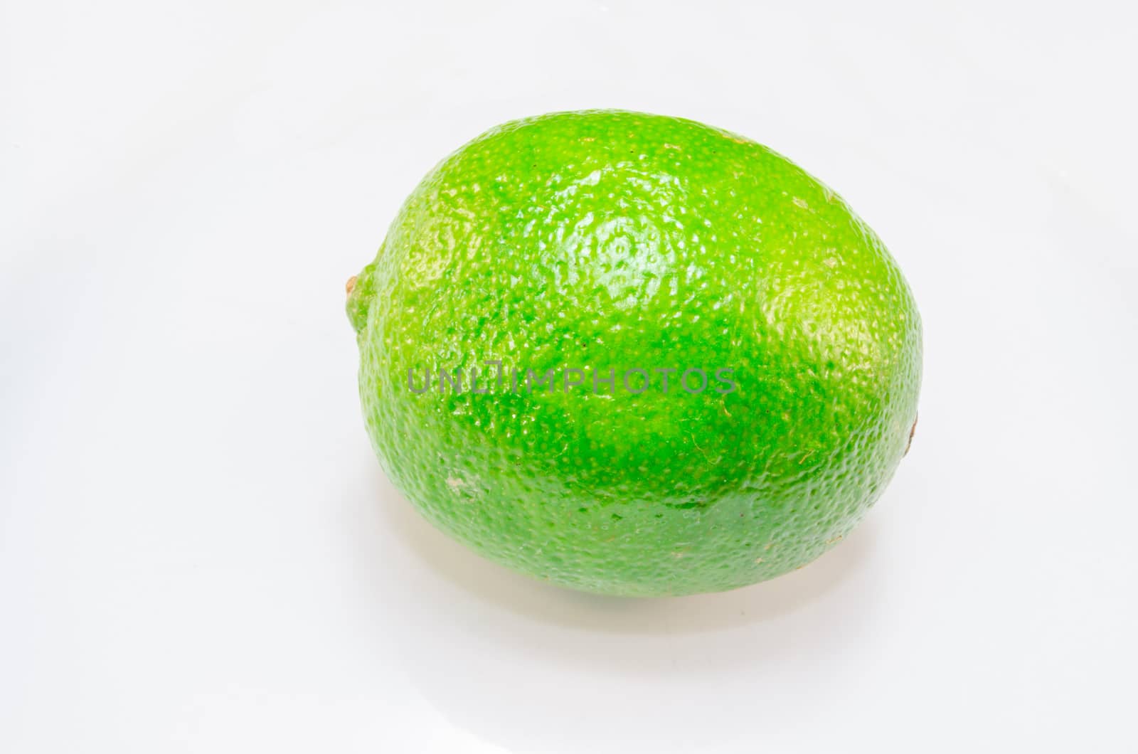 Green lime, lemon isolated on a white background.