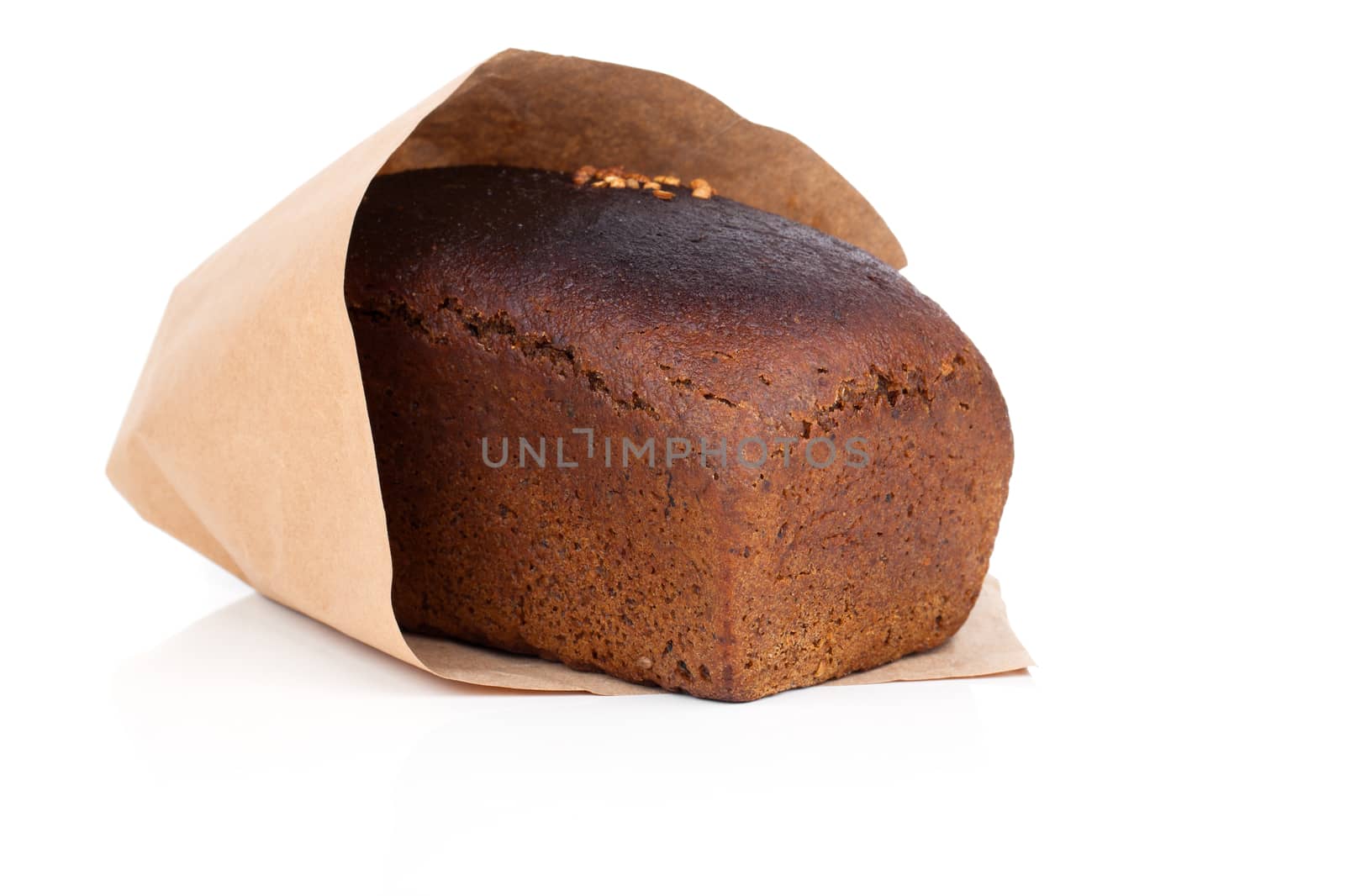 Rye bread slice in paper packaging, isolated on white background