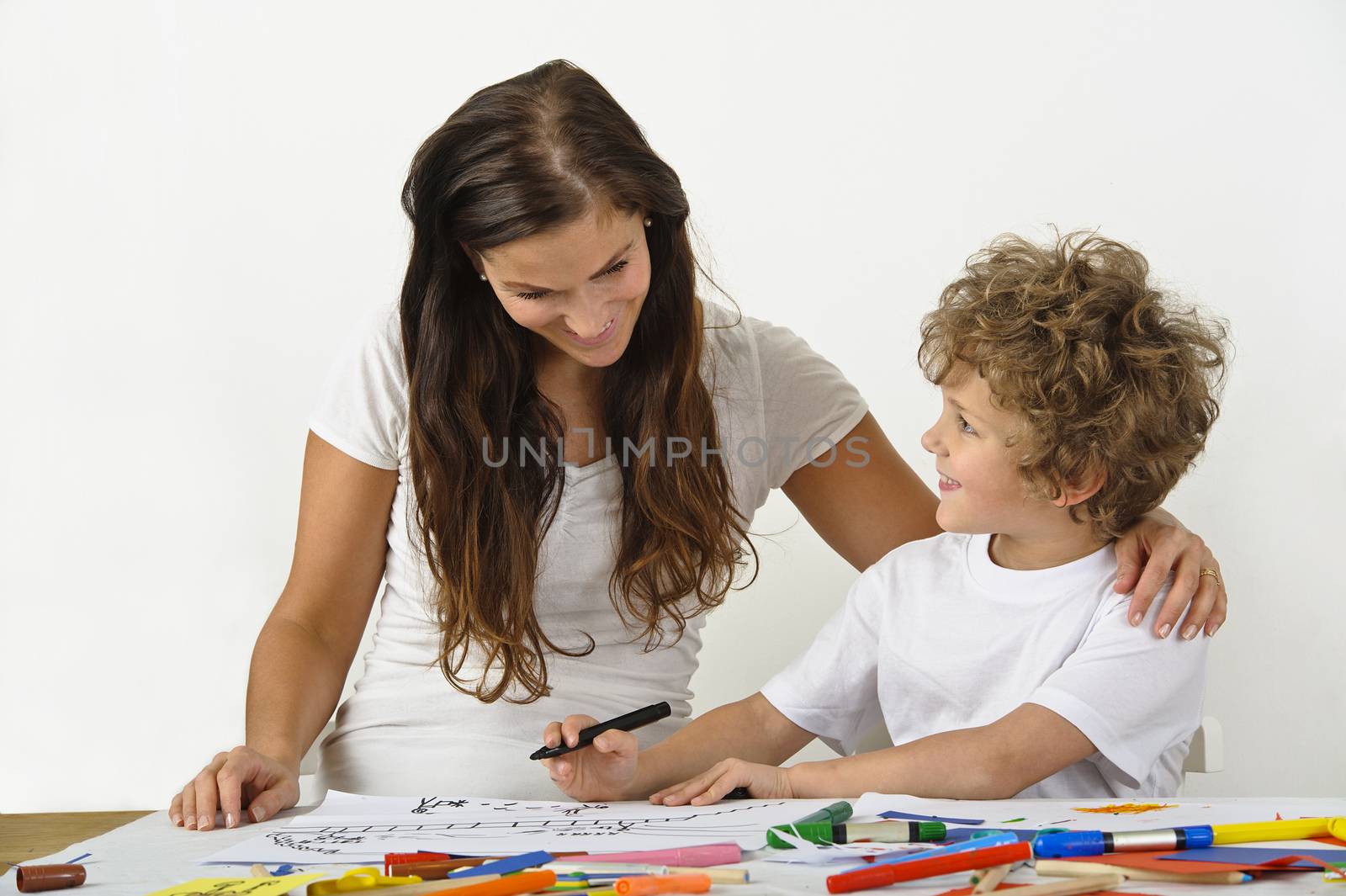 Mother teaches her child how to draw