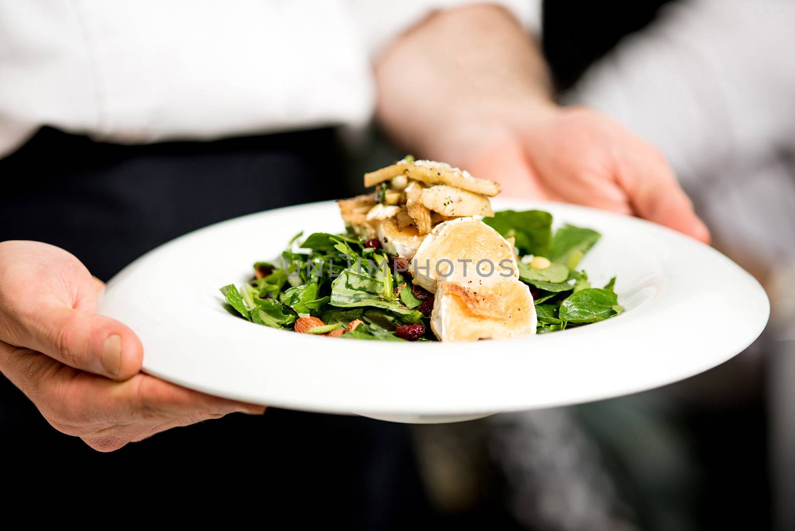 Your salad is ready sir.  by stockyimages