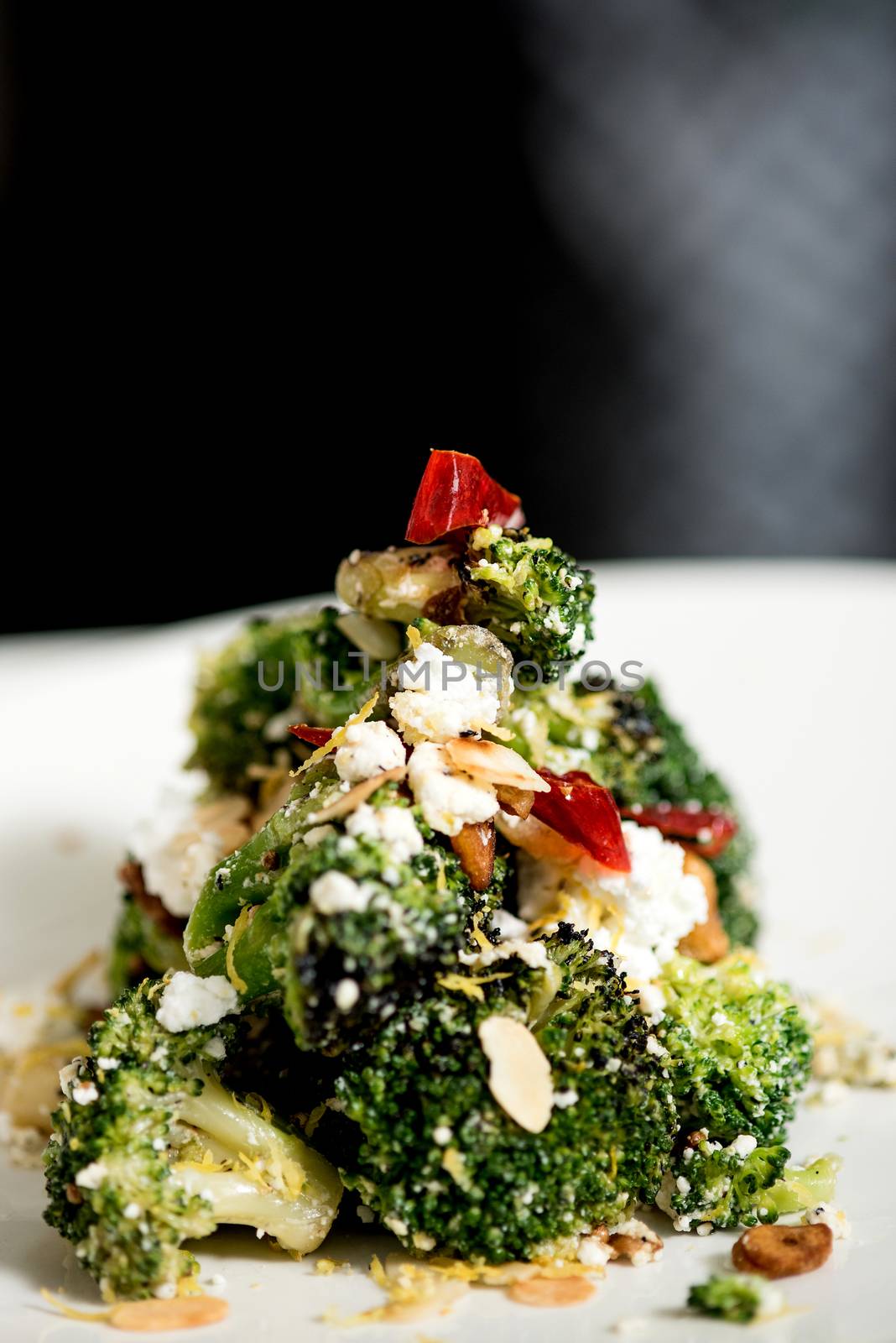Close up image of broccoli salad with feta cheese