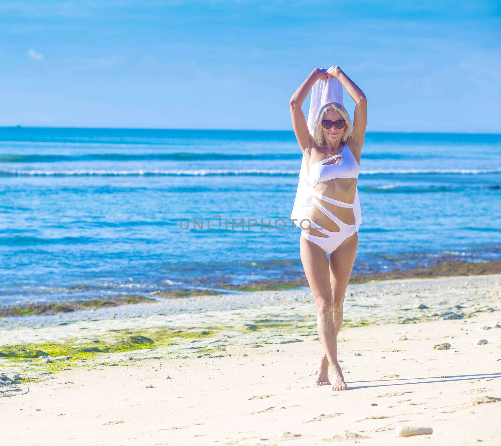 Young Woman in Bikini on a Tropical Sand Beach
released