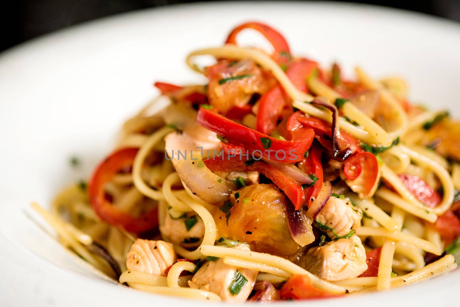 Tasty pasta with chicken. by stockyimages