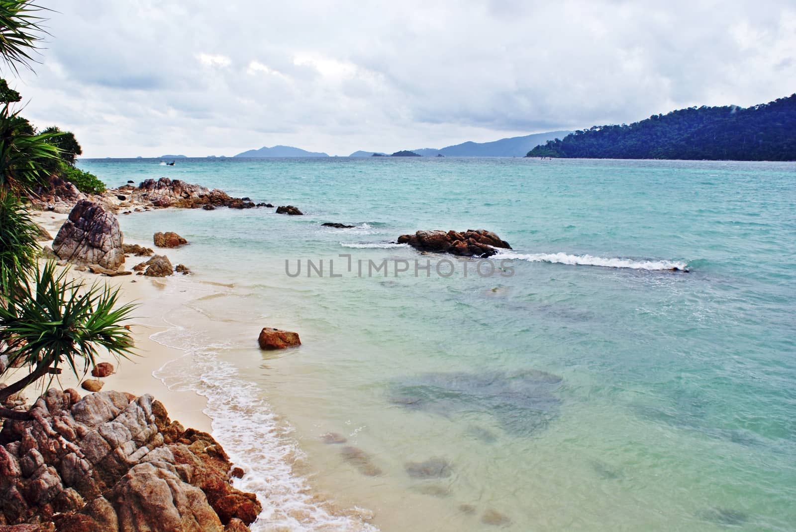 Clean and clear beach, rock and sea water in Lipe island, Thailand