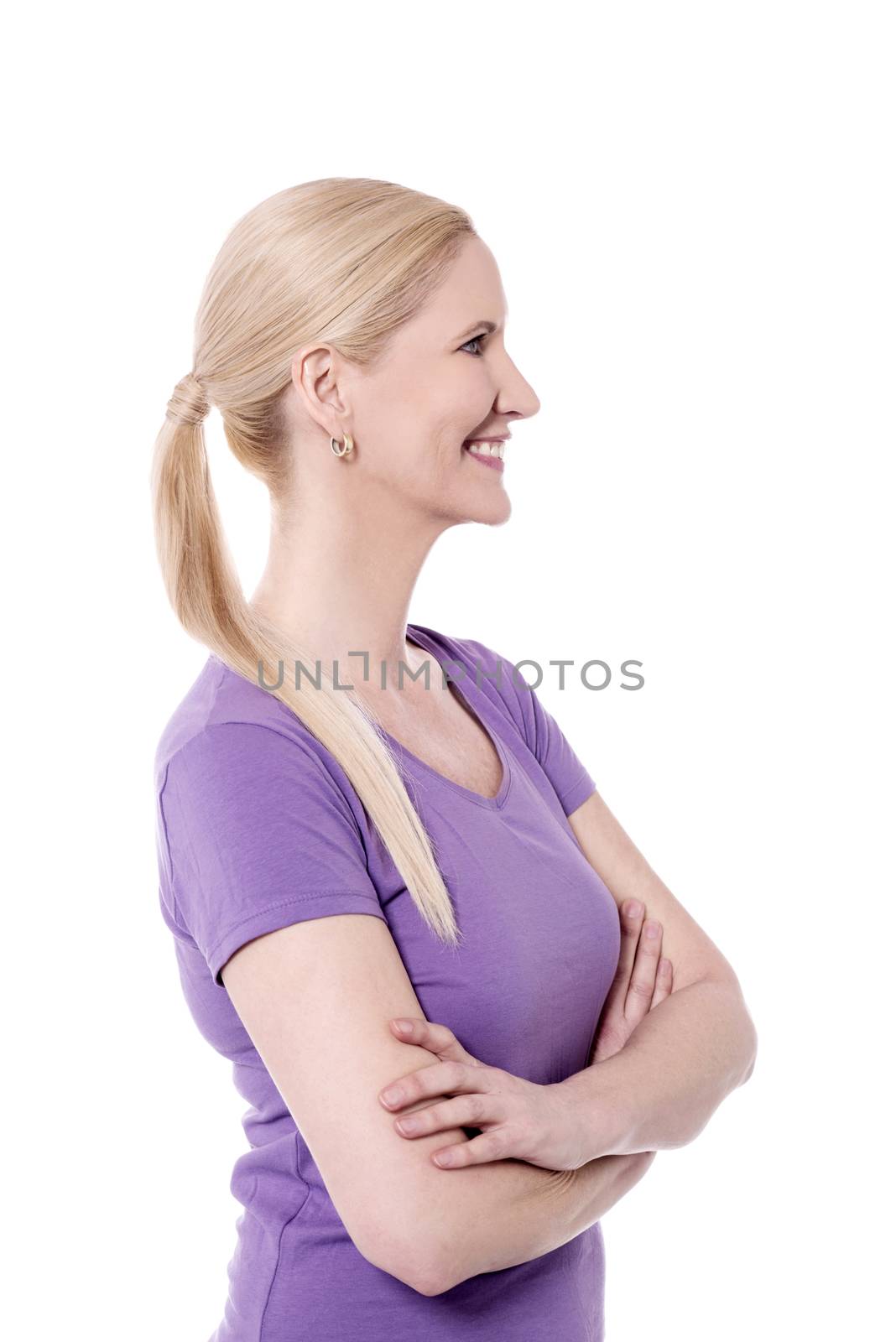 Folded arms happy woman looking at copy space