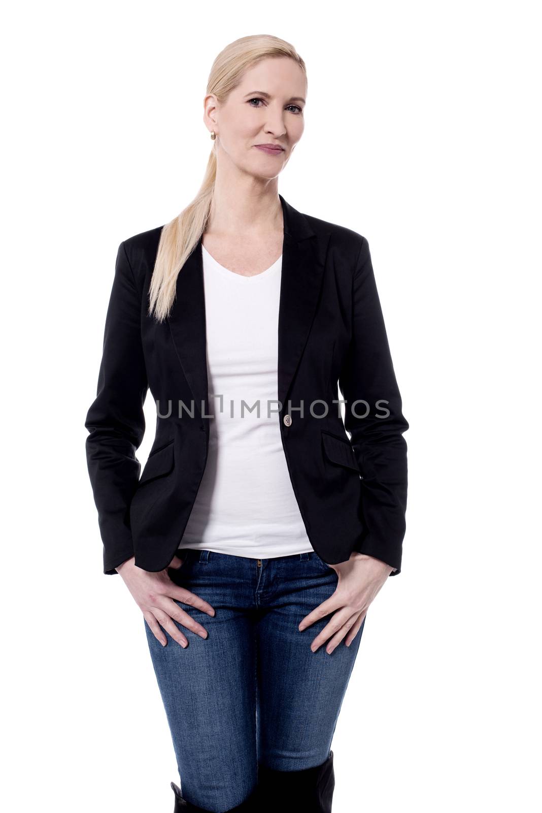 Stylish woman posing with hands in her pockets