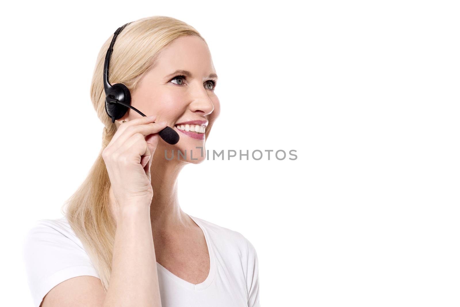 Sideways of female customer support executive on call