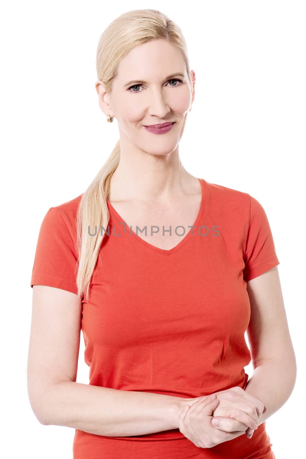Woman posing with clasped hands by stockyimages