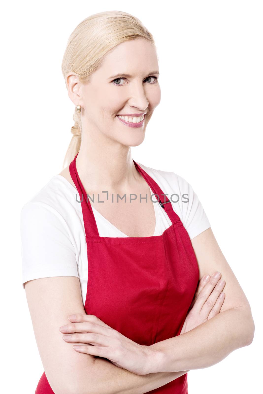 Confident female chef posing with arms crossed