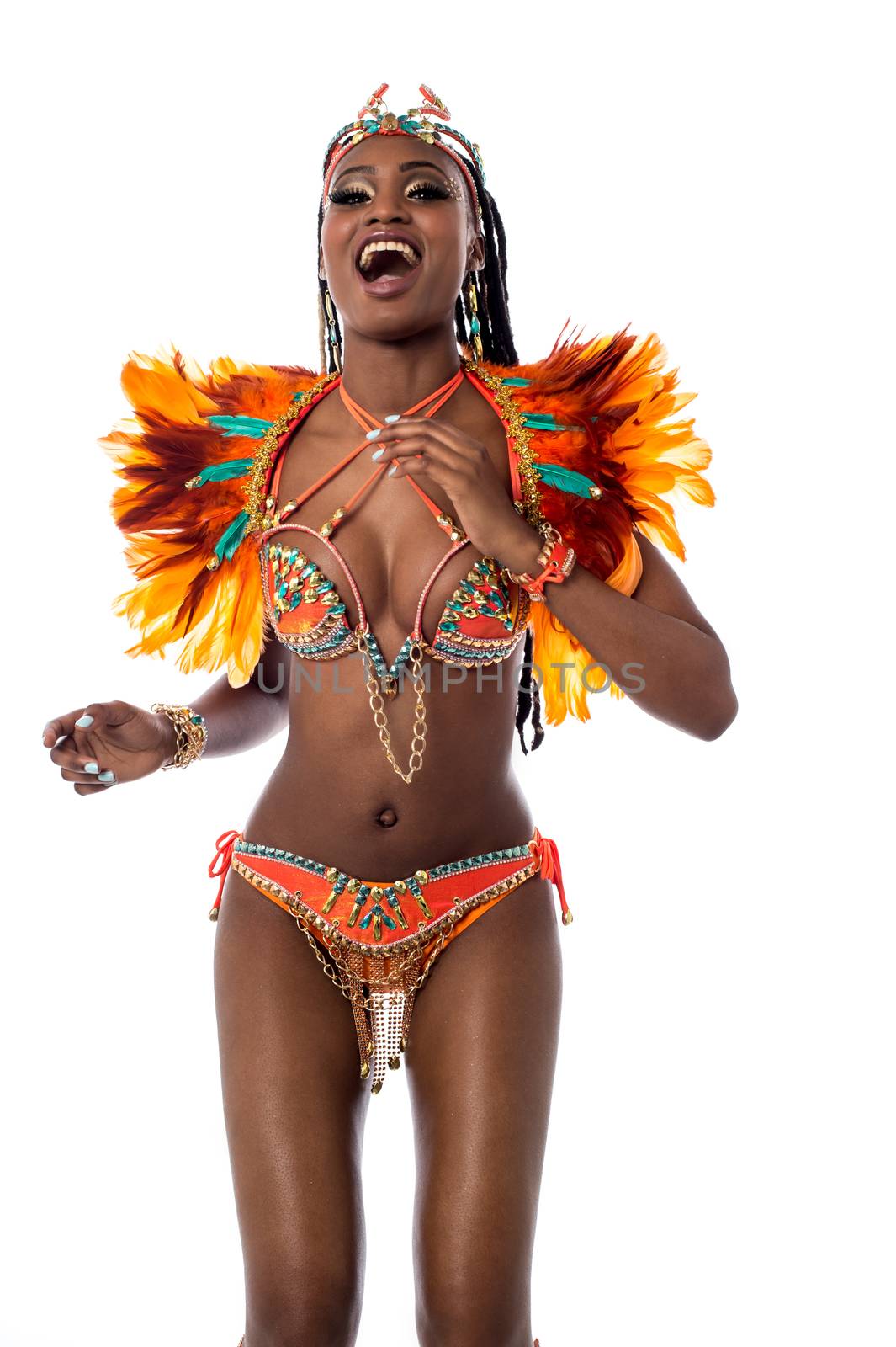 Cheerful woman dancing samba by stockyimages