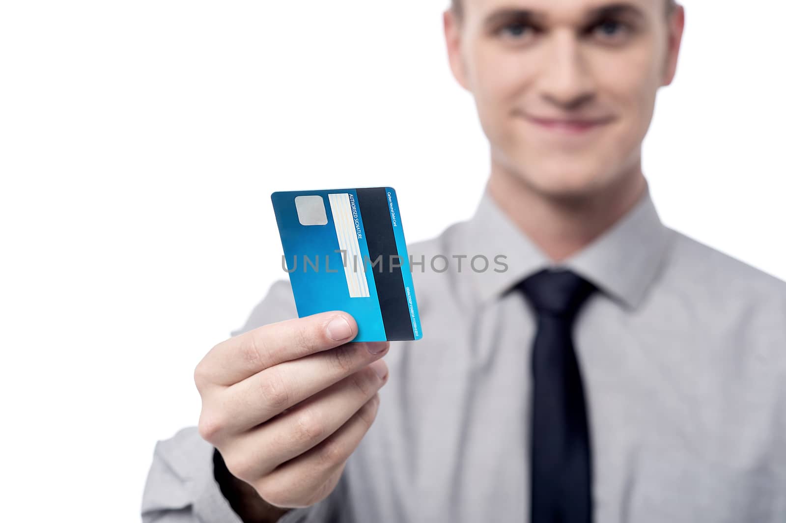 Male executive showing his credit card, focus on card.