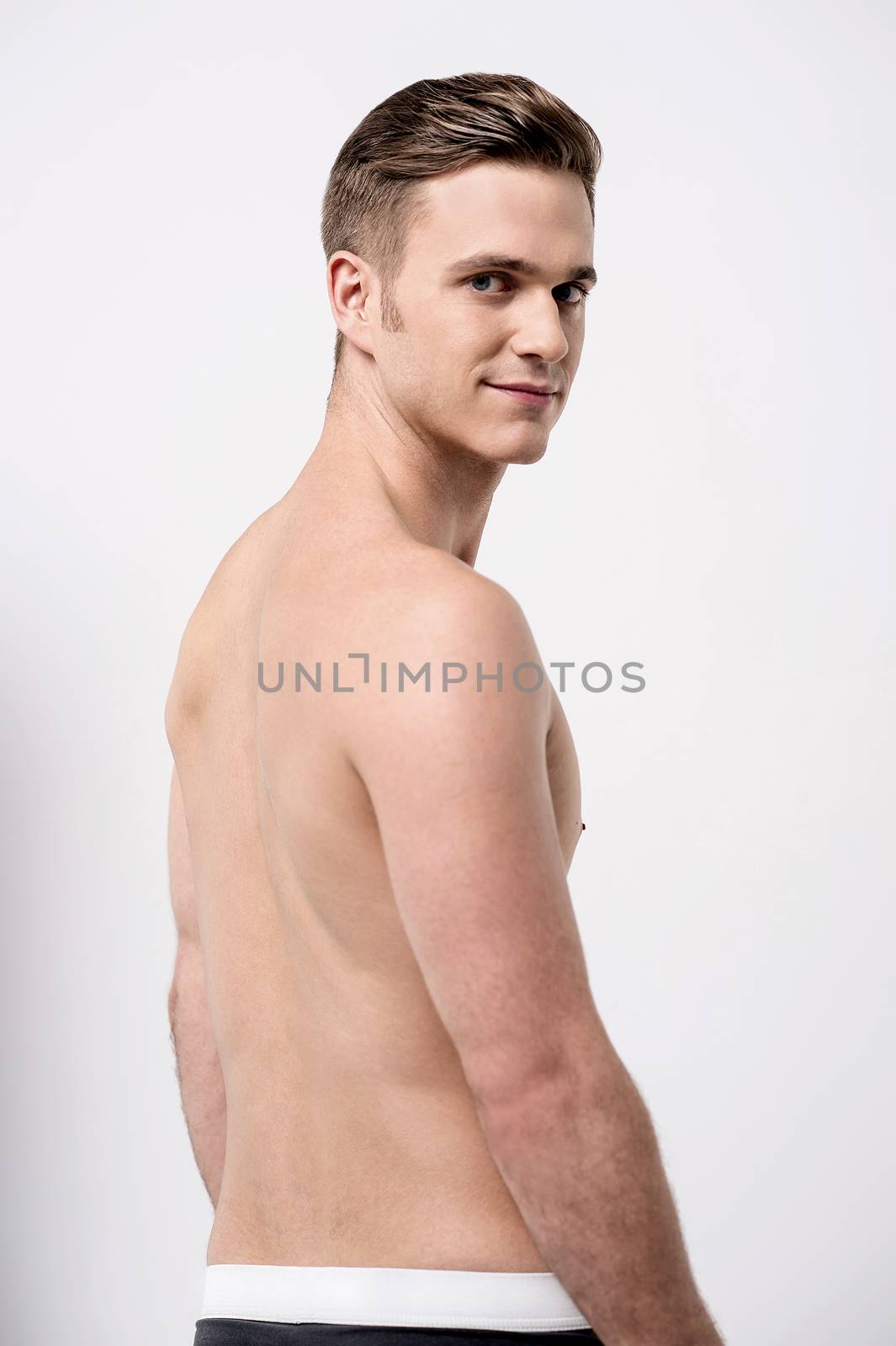 Young male in underwear by stockyimages