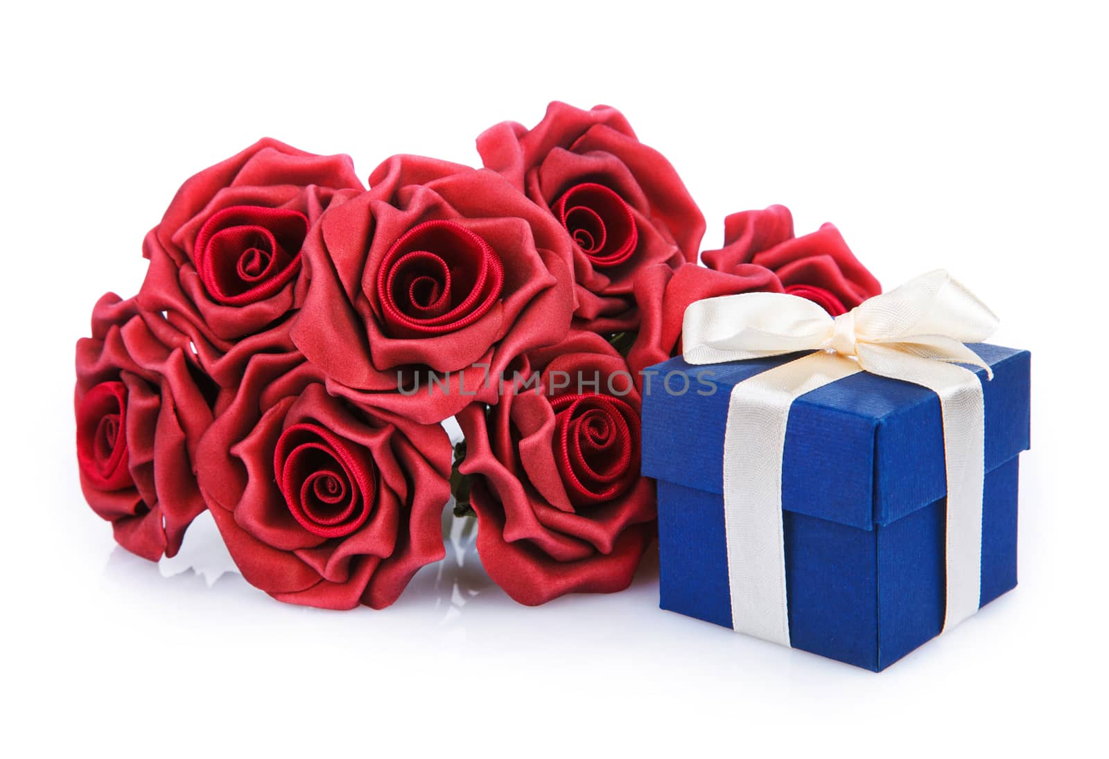 red flowers and blue gift box with ribbon on a white background