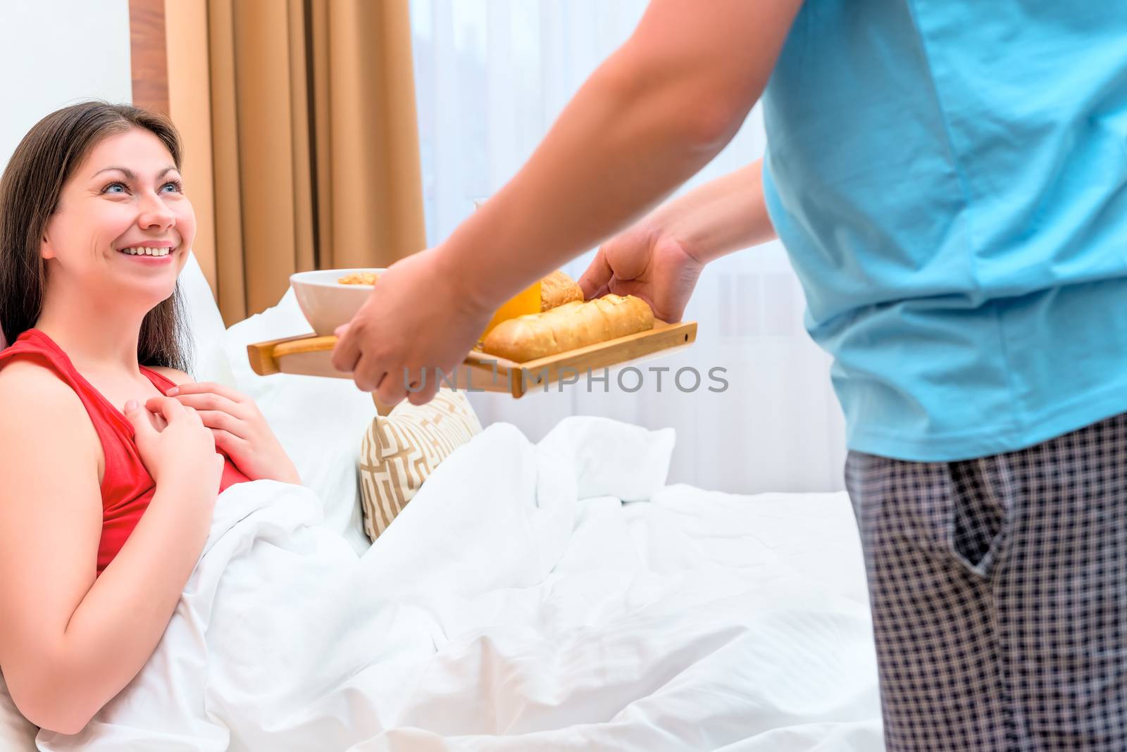 husband brought his wife breakfast in bed