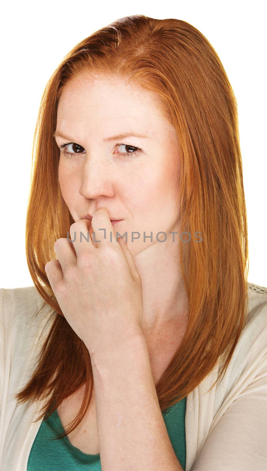 Thinking red haired woman with a devious expression