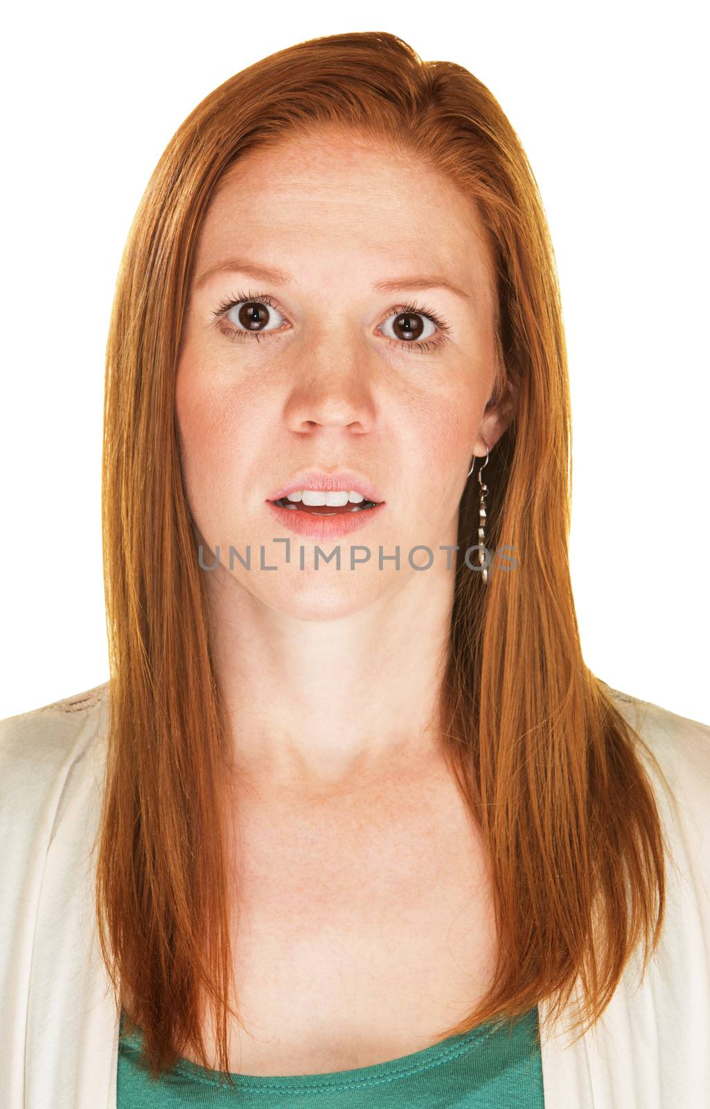 Young adult female with red hair staring